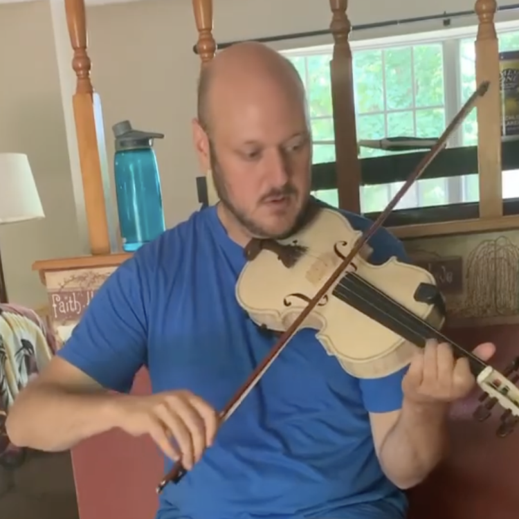 Fiddle player Phil Jones playing John's #2 fiddle while it's in the white.