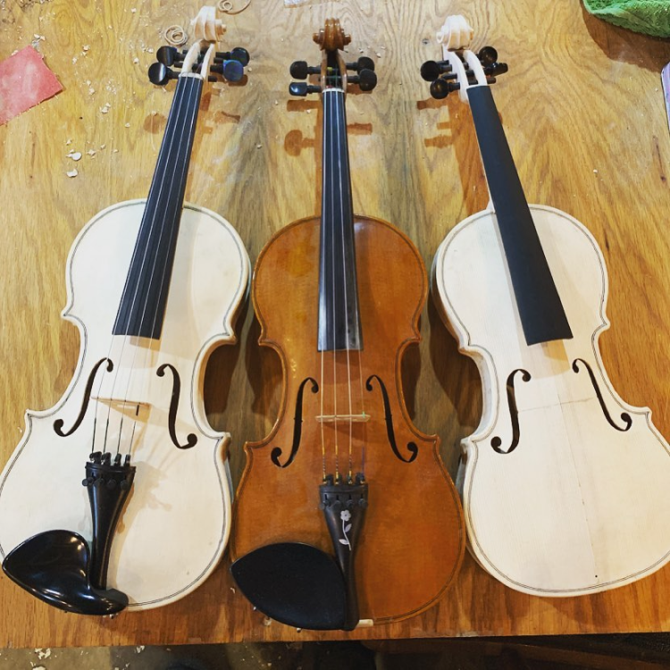 Three of John's instruments, two of which are "in the white."