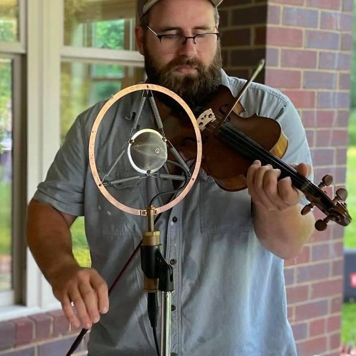 John Ryster playing one of his handmade violins